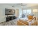 Bright living room featuring modern floors, and glass doors to the patio at 12243 S Chippewa Dr, Phoenix, AZ 85044