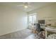 Functional office space with a desk, chair, and natural light from a window at 12243 S Chippewa Dr, Phoenix, AZ 85044