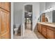 Bathroom showcasing a toilet, sink, and a sliding glass door to the backyard at 12647 S 41St Pl, Phoenix, AZ 85044