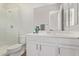 Bathroom with a glass door shower, white vanity, and an elongated toilet at 1294 E La Fortuna Ct, San Tan Valley, AZ 85140