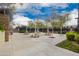 Picturesque picnic area with tables and shade trees near the tennis courts at 12957 W Hummingbird Ter, Peoria, AZ 85383