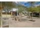 Picturesque picnic area with tables and shade trees with a stone structure at 12957 W Hummingbird Ter, Peoria, AZ 85383