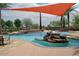 Resort-style pool with rock waterfall and seating area at 12957 W Hummingbird Ter, Peoria, AZ 85383