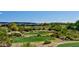 Scenic golf course view with lush green fairways and beautiful desert landscaping at 12957 W Hummingbird Ter, Peoria, AZ 85383