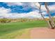 Beautiful golf course with lush green fairways, desert vegetation, and well-maintained landscaping at 12957 W Hummingbird Ter, Peoria, AZ 85383