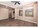 Spacious open concept living space, showcasing neutral paint, and seamless flow into adjacent spaces at 12957 W Hummingbird Ter, Peoria, AZ 85383