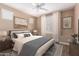 Beautifully decorated main bedroom with elegant furnishings, soft lighting, and a cozy ambiance at 12957 W Hummingbird Ter, Peoria, AZ 85383