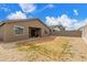 Rear exterior view of a property featuring a covered patio and potential for custom landscaping at 13352 W Tether Trl, Peoria, AZ 85383