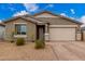 Charming single-story home with a two-car garage and low-maintenance landscaping at 13352 W Tether Trl, Peoria, AZ 85383