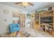 Comfortable living room showcasing open floorplan, tile floors and a ceiling fan at 13807 N Boswell Blvd, Sun City, AZ 85351