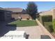 A backyard with a small patch of artificial turf and patio stones at 13812 W Remuda Dr, Peoria, AZ 85383