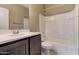 Bathroom showcasing a vanity, toilet, and a tub/shower combination at 13812 W Remuda Dr, Peoria, AZ 85383