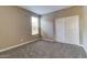 Bedroom with carpet, closet and neutral walls and a bright window at 13812 W Remuda Dr, Peoria, AZ 85383