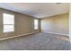 This bedroom features neutral walls, plush carpet, and natural light from two windows at 13812 W Remuda Dr, Peoria, AZ 85383
