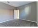 Neutral-toned bedroom with carpet, neutral walls and white trim at 13812 W Remuda Dr, Peoria, AZ 85383