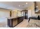 Bright kitchen featuring granite counters, stainless steel appliances, and an island at 13812 W Remuda Dr, Peoria, AZ 85383