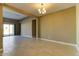 Spacious living room with tile floors and sliding glass doors leading to outdoor space at 13812 W Remuda Dr, Peoria, AZ 85383