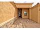 Inviting entryway with decorative stone accents and a stylish, ornate front door at 14161 S Palo Verde Trl, Casa Grande, AZ 85193