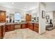 Bathroom featuring granite counters, wooden cabinets, and a soaking tub with a view at 14360 E Desert Cove Ave, Scottsdale, AZ 85259