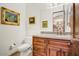 Elegant powder room with custom vanity, granite countertop, and stylish fixtures at 14360 E Desert Cove Ave, Scottsdale, AZ 85259