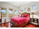 Comfortable bedroom with bright natural light, en-suite access, and hardwood flooring at 14360 E Desert Cove Ave, Scottsdale, AZ 85259