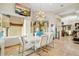 Bright dining area with mountain views, modern light fixture and seating for six at 14360 E Desert Cove Ave, Scottsdale, AZ 85259