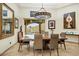 Formal dining room with designer lighting, elegant decor, and mountain view at 14360 E Desert Cove Ave, Scottsdale, AZ 85259