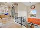 Grand foyer featuring tile steps, wrought iron railings, modern lighting, and gorgeous entryway at 14360 E Desert Cove Ave, Scottsdale, AZ 85259