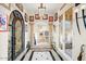 Grand foyer showcasing tile floors, ornate doorways, and artistic decor at 14360 E Desert Cove Ave, Scottsdale, AZ 85259