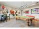 Bright game room featuring a pool table, seating and stylish lighting at 14360 E Desert Cove Ave, Scottsdale, AZ 85259
