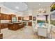 Spacious kitchen with custom cabinetry, granite counters, and a large island, perfect for entertaining at 14360 E Desert Cove Ave, Scottsdale, AZ 85259