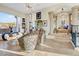 Elegant living room with tile flooring, fireplace, seating area, and view to the outside at 14360 E Desert Cove Ave, Scottsdale, AZ 85259