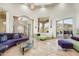 Bright living room featuring large windows with scenic views, stylish seating, and eye-catching light fixtures at 14360 E Desert Cove Ave, Scottsdale, AZ 85259