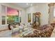 Bright living room featuring stylish seating and decorative accents, complemented by scenic mountain views at 14360 E Desert Cove Ave, Scottsdale, AZ 85259