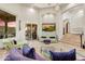 Spacious living room with tile flooring, high ceilings, and access to an outdoor patio at 14360 E Desert Cove Ave, Scottsdale, AZ 85259