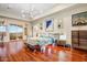 Spacious main bedroom with wood floors, modern lighting, and a private balcony with great views at 14360 E Desert Cove Ave, Scottsdale, AZ 85259