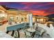 Outdoor patio with mountain views featuring a dining area, bar, lounge chairs, and a spa at 14360 E Desert Cove Ave, Scottsdale, AZ 85259