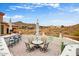Scenic outdoor patio with table seating, bar, and desert views, perfect for entertaining at 14360 E Desert Cove Ave, Scottsdale, AZ 85259