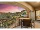 Comfortable outdoor seating area on a covered patio with scenic views of the surrounding desert landscape at 14360 E Desert Cove Ave, Scottsdale, AZ 85259