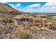 Spacious estate with desert landscaping and a scenic mountain backdrop at 14360 E Desert Cove Ave, Scottsdale, AZ 85259