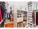 Organized walk-in closet with shelving, drawers, and hanging rods for maximum storage at 14360 E Desert Cove Ave, Scottsdale, AZ 85259