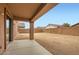 Expansive backyard featuring a covered patio, perfect for outdoor relaxation and entertaining at 14544 W Sierra St, Surprise, AZ 85379