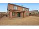 Backyard view of a two-story home with a covered patio and ample space for outdoor activities at 14544 W Sierra St, Surprise, AZ 85379