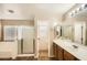 Bright bathroom featuring separate tub, walk-in shower, and spacious vanity at 14544 W Sierra St, Surprise, AZ 85379
