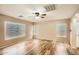 Bedroom with wood flooring, recessed lighting, and multiple windows with window coverings at 14544 W Sierra St, Surprise, AZ 85379