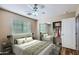 Bedroom features stylish decor, wood floors, and a mirrored closet at 14544 W Sierra St, Surprise, AZ 85379