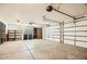 The spacious two-car garage is equipped with storage shelves at 14544 W Sierra St, Surprise, AZ 85379