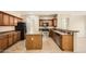 Functional kitchen with an island, stainless steel appliances, and rich cabinetry at 14544 W Sierra St, Surprise, AZ 85379