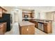 Well-equipped kitchen featuring an island, stainless steel appliances, and ample cabinet space at 14544 W Sierra St, Surprise, AZ 85379