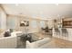 Staged living room with neutral furniture, recessed lighting, and an open floor plan at 14544 W Sierra St, Surprise, AZ 85379